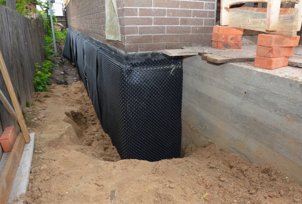 SJ Waterproofing Pros technician performing targeted Waterproofing assessment in Greenfield, IL